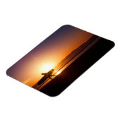 Surfen mit Surfbrett am Strand bei Sunset Magnet (Linke Seite)