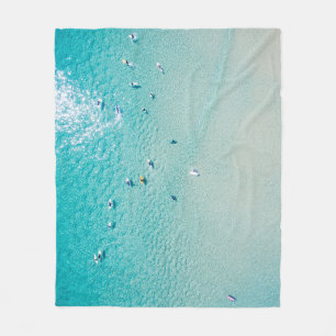Surfer aus der Luft, klare Ozeane. Fleecedecke