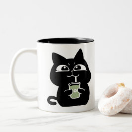 Süße dicke schwarze Katze Kaffeetasse