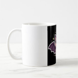 Süße Fledermaus hält Candy Corn Kaffeetasse