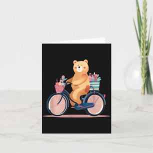 Süße Frau fährt Fahrrad mit lustiger Teddybär-Graf Karte