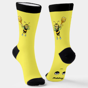 Süße glückliche Honigbiene auf schwarzen und gelbe Socken