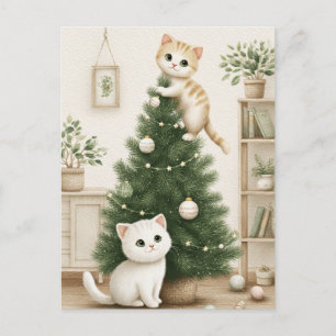 Süße Kätzchen spielen mit dem Weihnachtsbaum Feiertagspostkarte