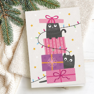Süße Katze mit Lichtern und Weihnachtsgeschenken Feiertagskarte
