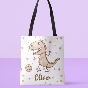 Süße kleine Dino spielt Fußball personalisiert Tasche