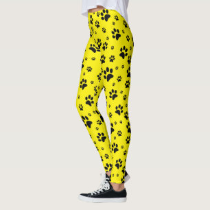 Süße lustige schwarze Pfotenabdrücke auf strahlend Leggings