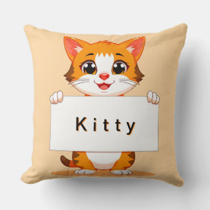 Süße orange Katze hält ein leeres Schild Kissen