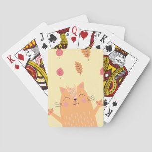 Süße orangefarbene Katze spielt im Herbstlaub Spielkarten