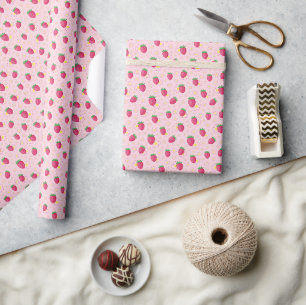 Süße rosa rote Erdbeeren, gelbe Gänseblümchen. Geschenkpapier