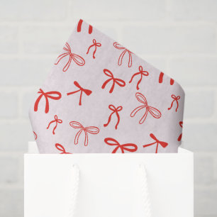 Süße rote Doodle-Schleife auf rosa Seidenpapier