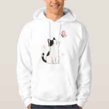 Süße Schwarz-Weiß-Katze mit rosa Schmetterling