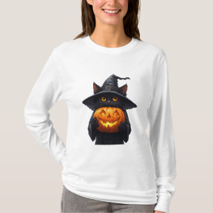 Süße schwarze Hexenkatze hält leuchtenden Kürbis � T-Shirt