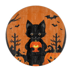 Süße schwarze Katze mit Halloween-Kürbissen Schneidebrett