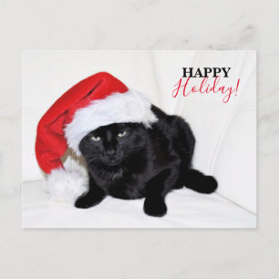 Süße schwarze Katze mit Weihnachtsmannmütze Feiertagspostkarte