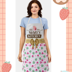 Süße Teetasse und Cupcake in einer hübschen Muster Schürze