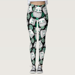 Süße und verspielte Katze schaut aus einer Tasche  Leggings