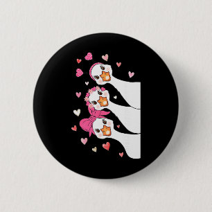 Süße Valentinstag-Gänse mit rosa Herzen und Kokett Button