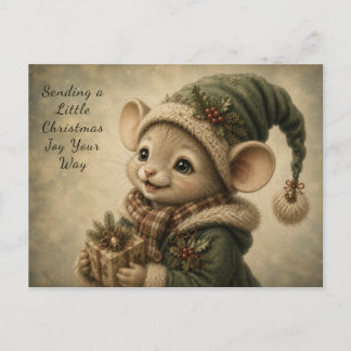 Süße Weihnachtsmaus mit einem Geschenk als Feierta Feiertagspostkarte