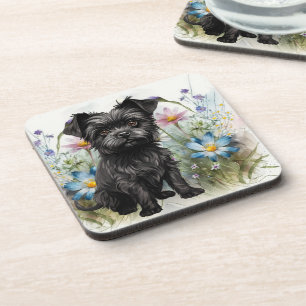 Süßer Affenpinscher-Hund auf einem Feld mit Wildbl Getränkeuntersetzer
