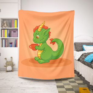Süßer Baby-Drache hält Tasse auf Orange Sherpadecke