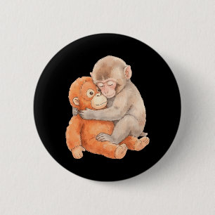Süßer Babyaffe namens Punch Plüsch umarmend Button