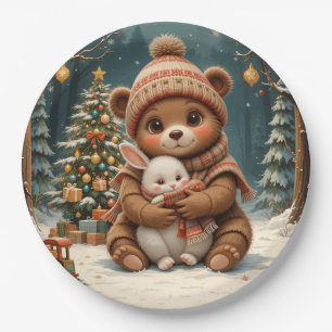 Süßer Bär hält Hasen neben dem Weihnachtsbaum Pappteller