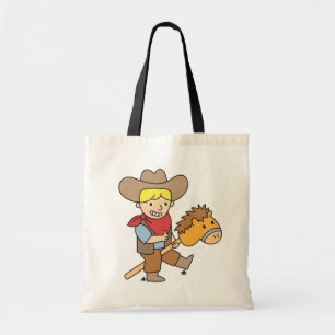 Süßer Cowboy reitet auf einem Steckenpferd Tragetasche