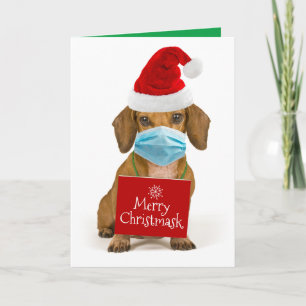 Süßer Dachshund mit Gesichtsmaske - Frohe Christma Feiertagskarte