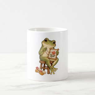 Süßer Frosch beim Sticken einer Blume Nadelspitzen Kaffeetasse