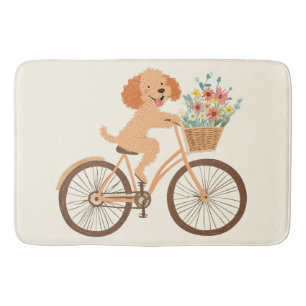 Süßer Goldendoodle-Hund beim Radfahren mit Frühlin Badematte