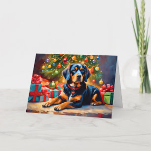 Süßer Hund am Weihnachtsbaum Feiertagskarte