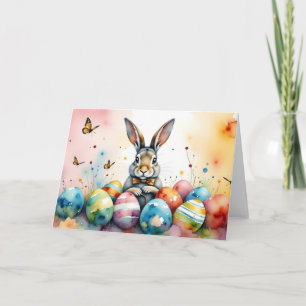 Süßer Osterhase mit farbenfrohen bemalten Eiern Karte