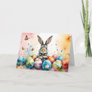 Süßer Osterhase mit farbenfrohen bemalten Eiern Karte