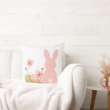 Süßer rosa Osterhase mit Frühlingsblumen