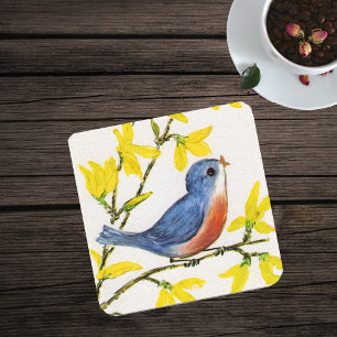 Süßer singender blauer Vogel auf einem Baumzweig Untersetzer