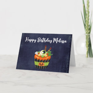 Süßer und gruseliger Halloween-Cupcake mit einem g Karte
