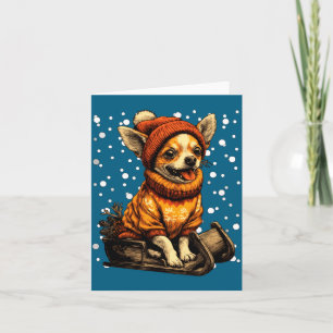 Süßer Weihnachts-Chihuahua beim Schlittenfahren im Karte