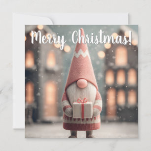 Süßer Weihnachts-Gnom mit einer Geschenkschachtel Feiertagskarte