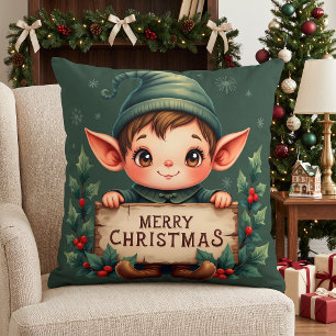 Süßer Weihnachtself hält fröhliches Schild in Grün Kissen