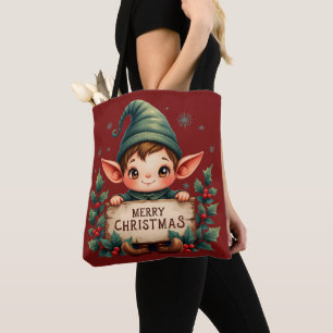 Süßer Weihnachtself hält fröhliches Schild Rot Tasche