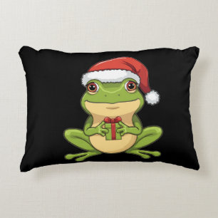 Süßer Weihnachtsfrosch mit Santa-Hut, der ein Gesc Dekokissen