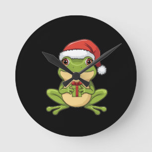 Süßer Weihnachtsfrosch mit Santa-Hut hält Geschenk Runde Wanduhr