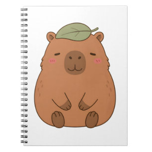 Süßes Capybara mit grünem Blatt auf dem Kopf Notiz Notizblock