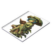 Süßes Froschmädchen liest Buch unter einem Blatt (Linke Seite)