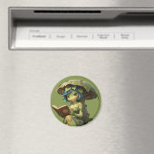Süßes Froschmädchen liest Buch unter einem Blatt Magnet (In Situ (Geschirrspüler))