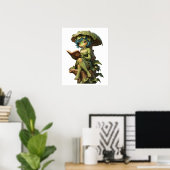 Süßes Froschmädchen liest Buch unter einem Blatt Poster (Heimbüro)
