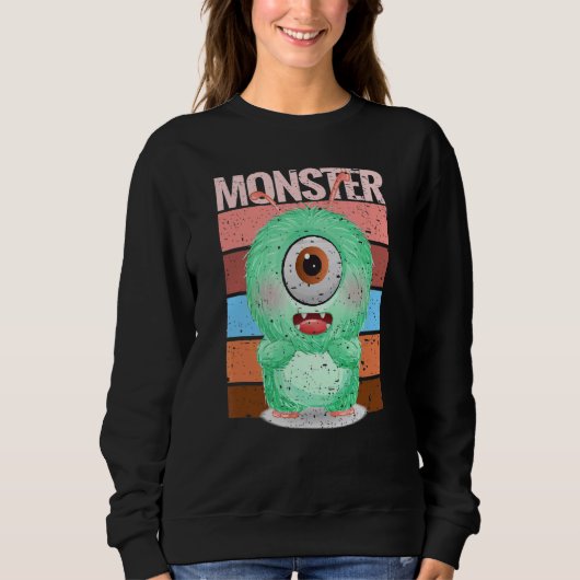 Süßes Monster in grüner Kruste mit einem riesigen Sweatshirt (Vorderseite)