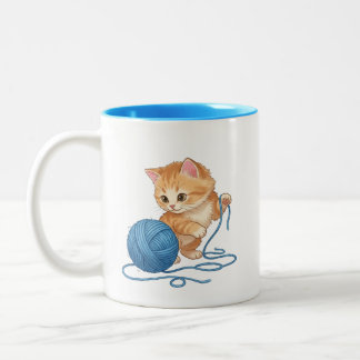 Süßes orangefarbenes Kätzchen mit Garnball Zweifar Zweifarbige Tasse