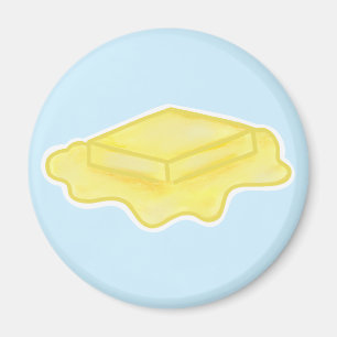 Süßes schmelzendes Butterstück auf Blau Magnet