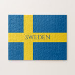 Sweatflagge Puzzle<br><div class="desc">Flagge Schwedens. Die Flagge Schwedens ist ein skandinavisches Kreuz, das sich bis an den Rand der Flagge erstreckt. Dieses skandinavische Kreuz repräsentiert das Christentum. Das Design und die Farben der schwedischen Flagge werden vermutlich durch die gegenwärtige Wappen Schwedens von 1442 inspiriert, die blau durch eine Kreuzpattée aus Gold aufgeteilt und...</div>